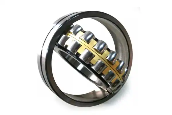 How do spherical roller bearings compensate for shaft deflection?